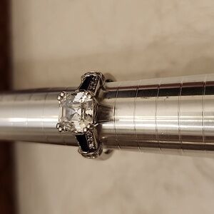 Diamond simulant center with sapphire simulant baguettes on each side size 7